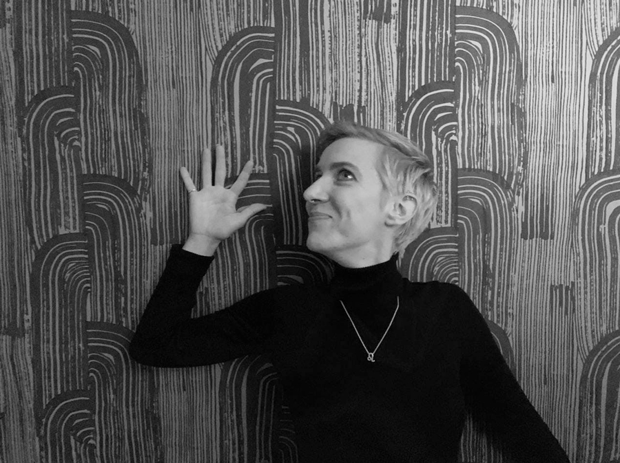 Lee Bec standing against a wall